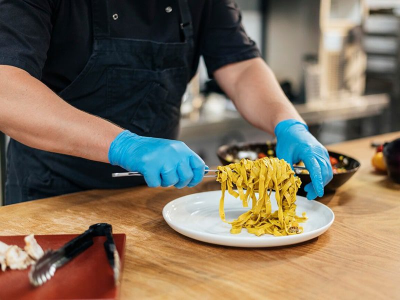 Preparing seafood pasta